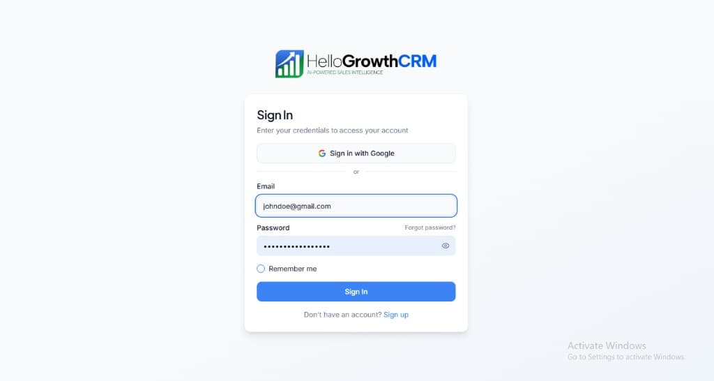 HelloGrowthCRM login screen: Sign in with Google, email and password fields, Remember me, and Sign up link